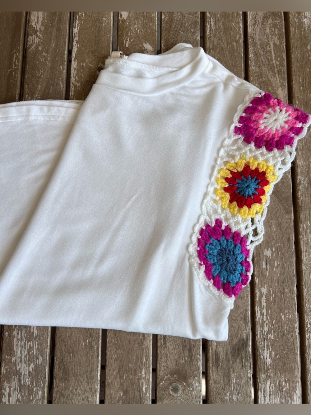 JODIFL size small White Tee with Crochet Floral Accent